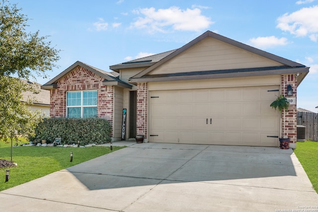 ranch-style home featuring central AC, a garage, and a front lawn