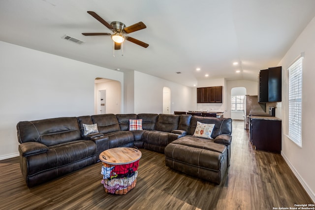 living room featuring dark hardwood / wood-style floors and ceiling fan