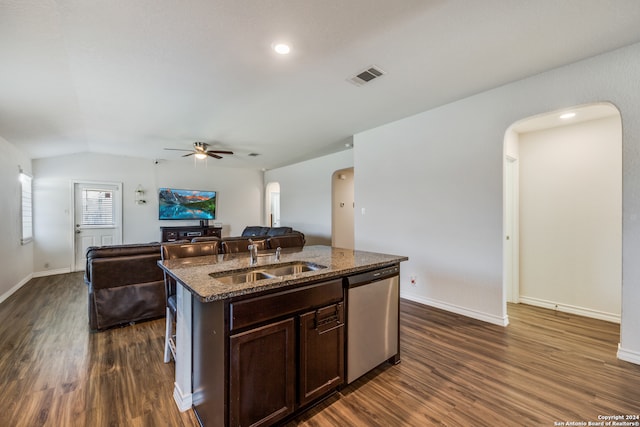 kitchen featuring dark hardwood / wood-style flooring, stainless steel dishwasher, dark brown cabinets, a kitchen island with sink, and sink