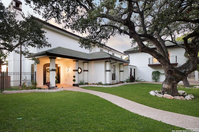 view of front of house with a yard