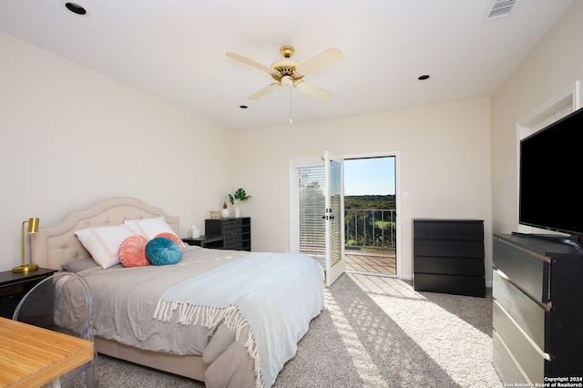 bedroom with access to exterior, ceiling fan, and light colored carpet