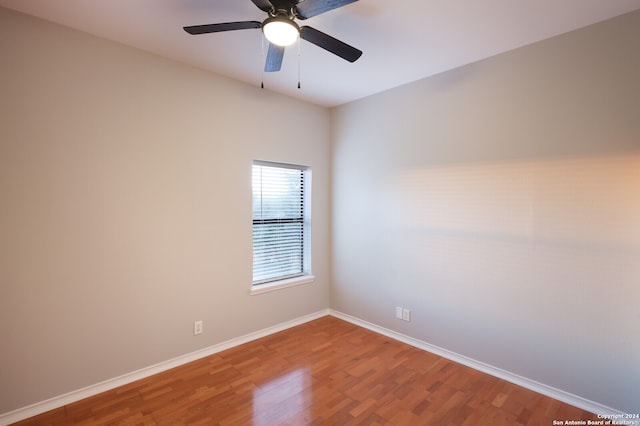 unfurnished room with hardwood / wood-style floors and ceiling fan