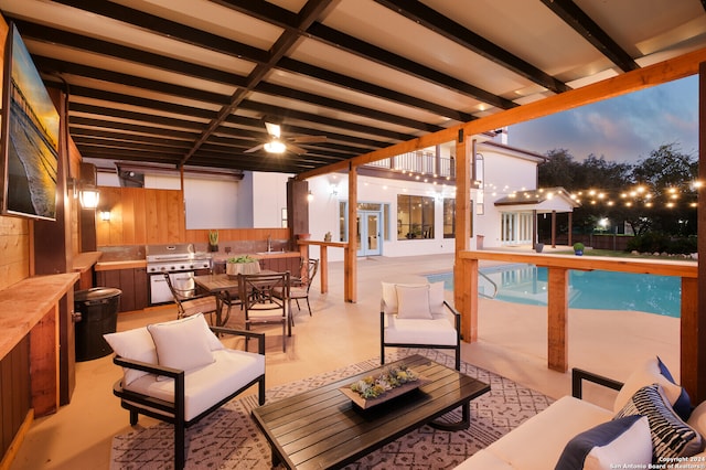 exterior space featuring french doors, sink, an outdoor living space, a fenced in pool, and area for grilling