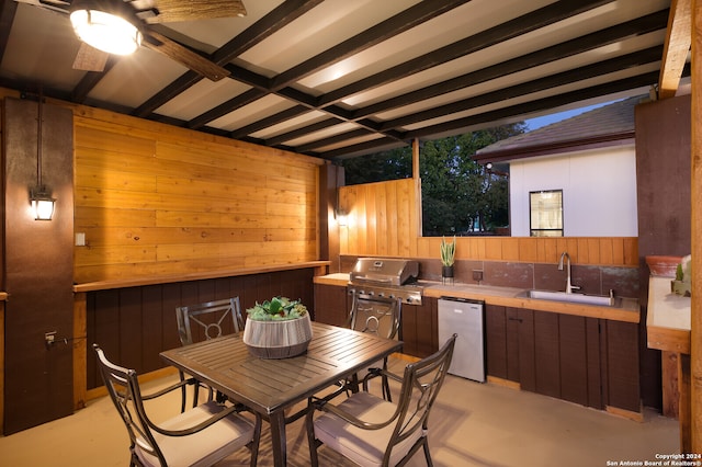 view of patio featuring a grill, sink, and exterior kitchen