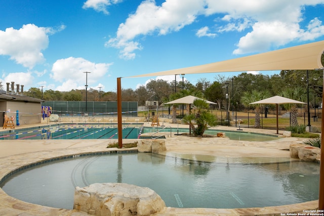 view of swimming pool featuring a patio