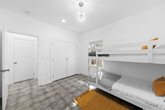 1153 Singing Hills Dr, Canyon Lake, TX 78133 - bedroom featuring tile patterned floors, a chandelier, a closet, baseboards, and recessed lighting