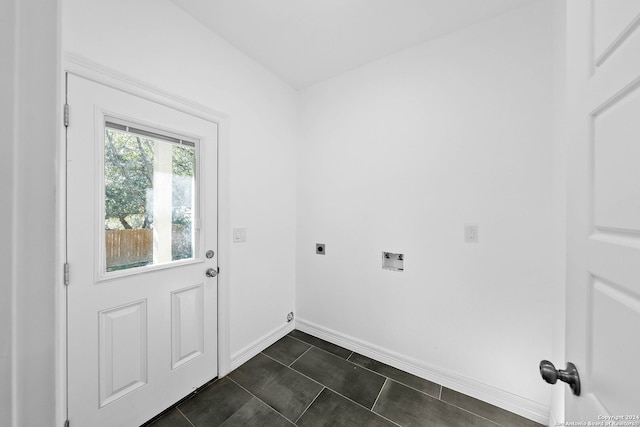 laundry area with dark tile patterned floors, washer hookup, and hookup for an electric dryer