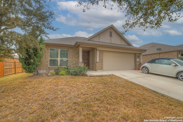 view of front of house featuring a garage and a front yard