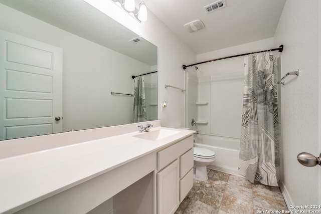 full bathroom featuring vanity, toilet, and shower / tub combo