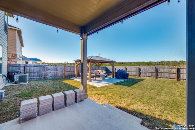 view of yard with a gazebo, central AC unit, and a patio area