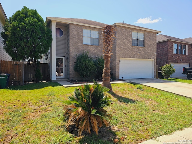 view of front of home featuring a garage and a front lawn