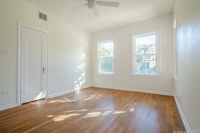 spare room featuring ceiling fan and wood-type flooring