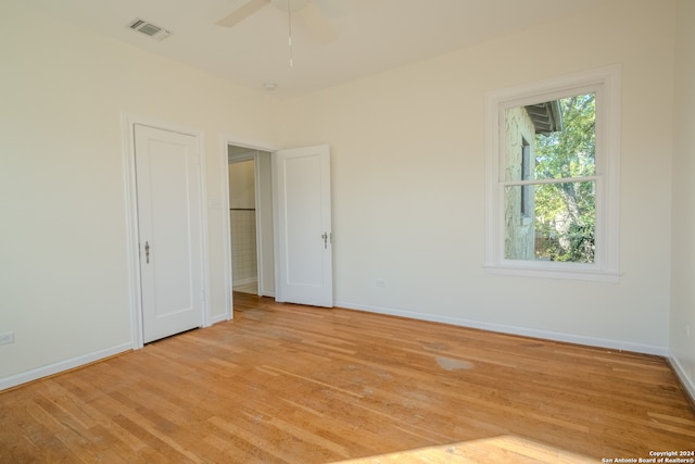 unfurnished bedroom featuring ceiling fan and light hardwood / wood-style flooring