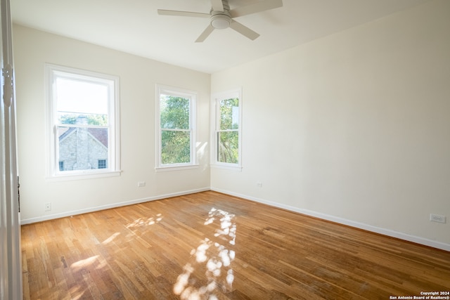 empty room featuring ceiling fan and wood-type flooring