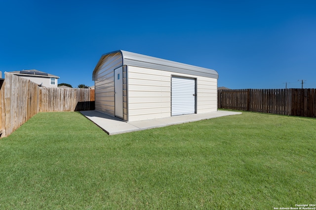 view of outdoor structure with a lawn