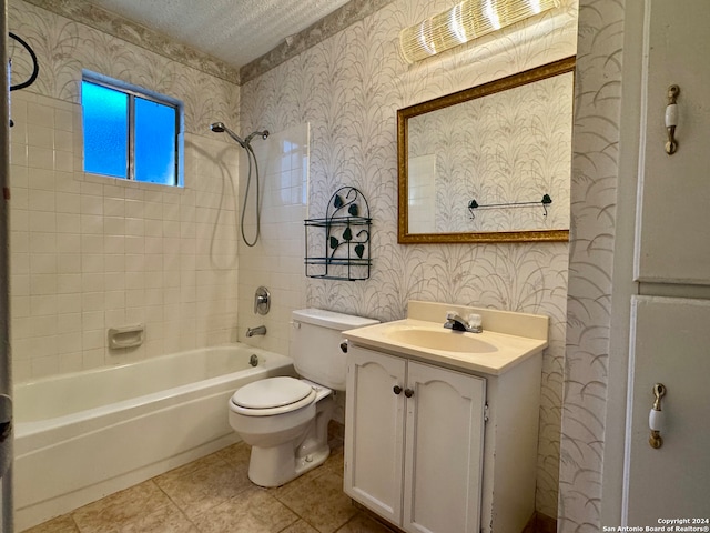 full bathroom featuring tiled shower / bath combo, tile patterned floors, a textured ceiling, toilet, and vanity