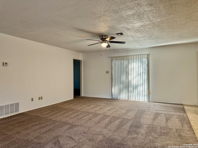 unfurnished room with light carpet, ceiling fan, and a textured ceiling