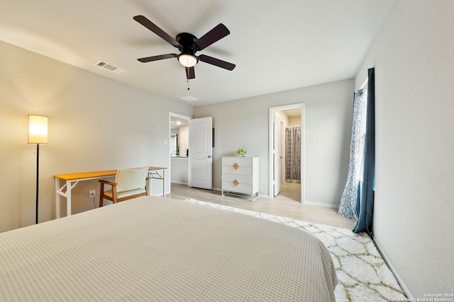 bedroom with ceiling fan, light wood-type flooring, and multiple windows