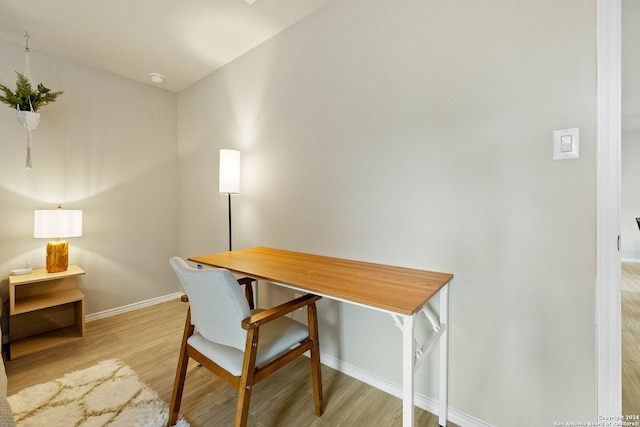 office with light hardwood / wood-style floors