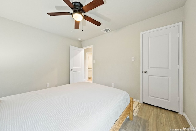 bedroom with ceiling fan and light wood-type flooring