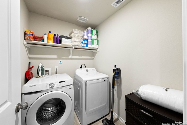 washroom with washer and dryer