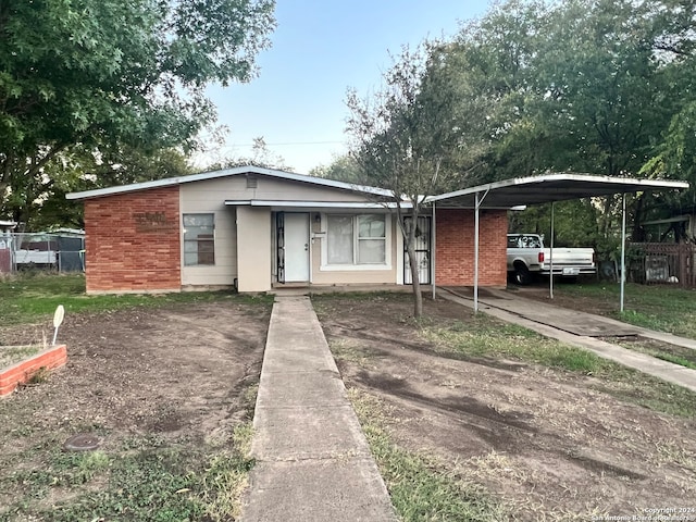 view of front of home featuring a carport