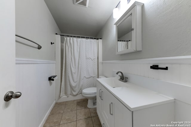 full bathroom with tile patterned flooring, vanity, shower / bath combination with curtain, and toilet