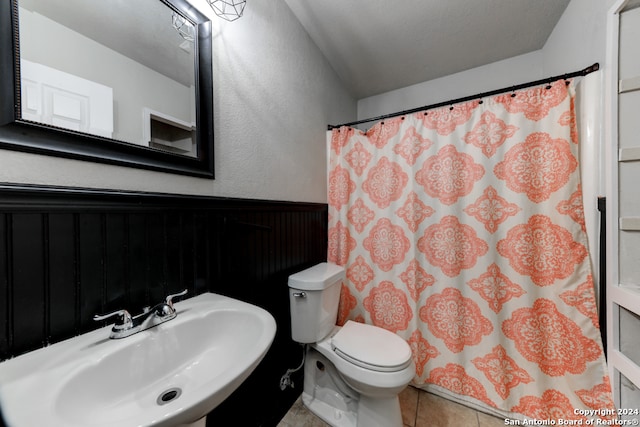 bathroom featuring tile patterned floors, sink, and toilet