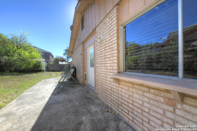 view of side of property featuring a patio