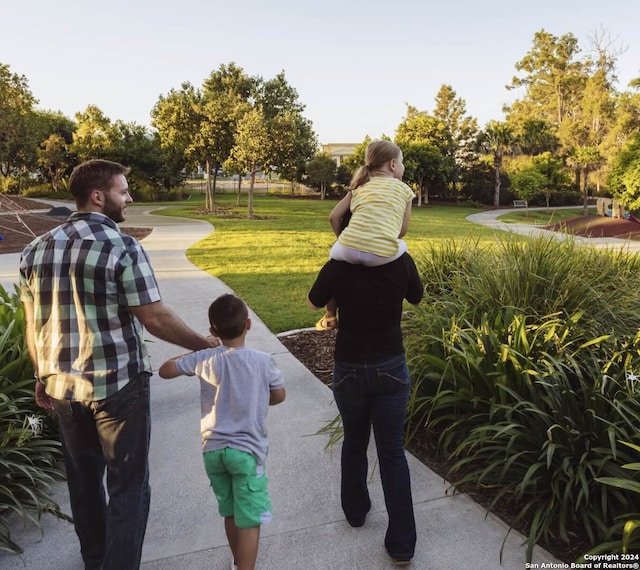 surrounding community featuring a lawn