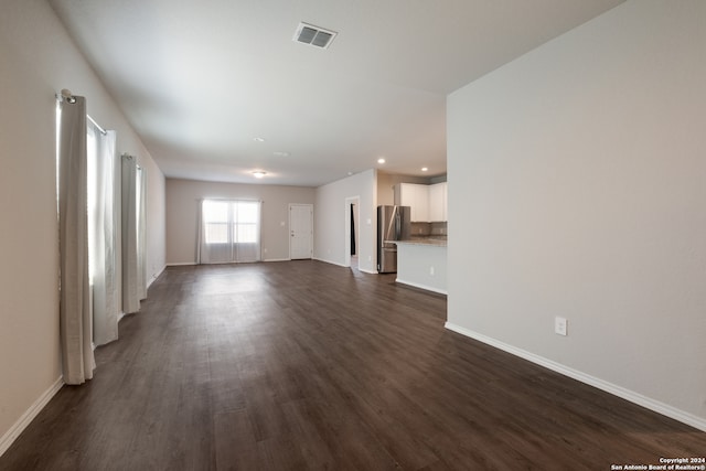 unfurnished living room featuring dark wood-type flooring