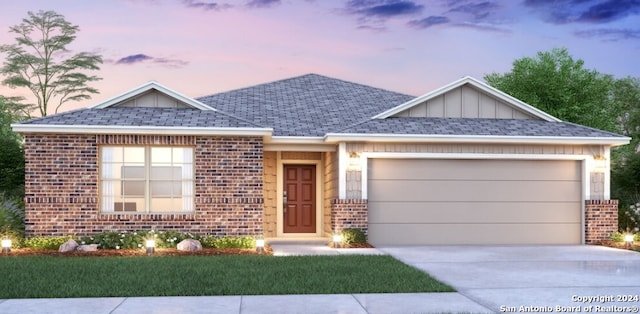 ranch-style home featuring driveway, board and batten siding, roof with shingles, an attached garage, and brick siding