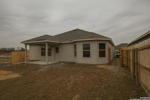 back of property featuring cooling unit, a patio, and fence