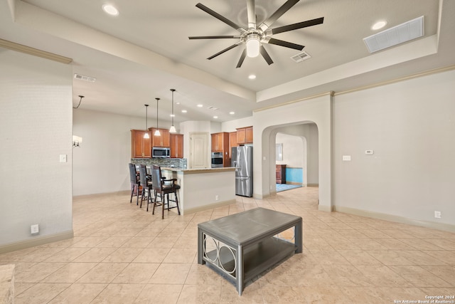 tiled living room featuring ceiling fan