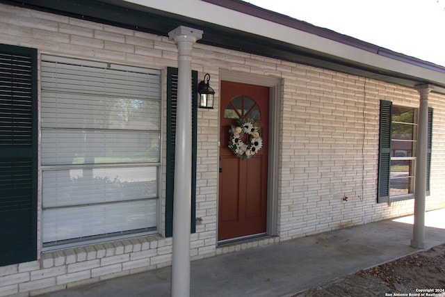 doorway to property with a porch