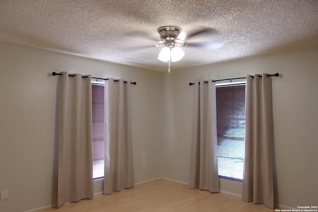 608 Val Verde Dr, Pleasanton, TX 78064 - empty room featuring light wood-type flooring, ceiling fan, and a textured ceiling