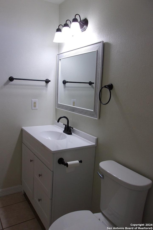 608 Val Verde Dr, Pleasanton, TX 78064 - half bath featuring toilet, vanity, and tile patterned flooring