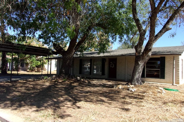 view of front of home with a carport