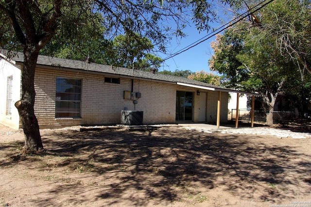 608 Val Verde Dr, Pleasanton, TX 78064 - rear view of property with brick siding, a patio, and cooling unit