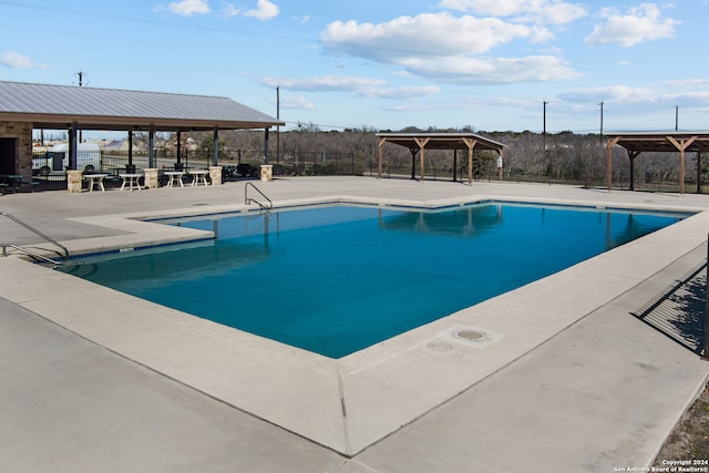 view of swimming pool with a gazebo and a patio