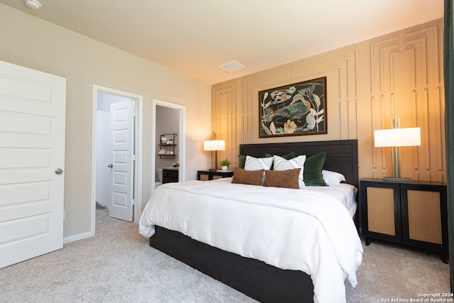 bedroom featuring light carpet