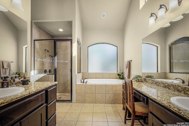 bathroom with tile patterned flooring, vanity, and independent shower and bath