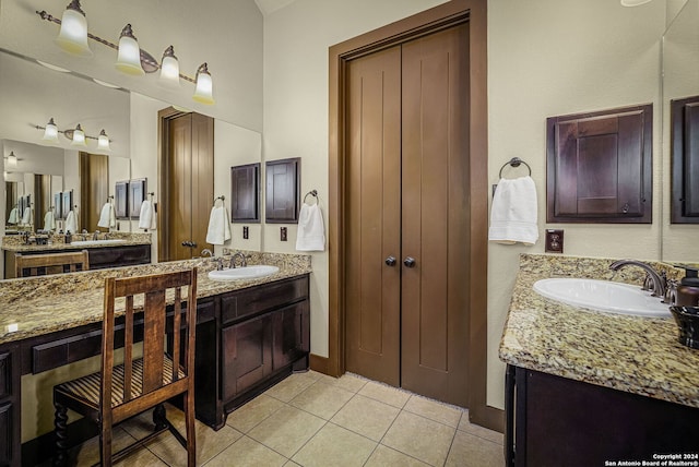 bathroom featuring tile patterned flooring and vanity