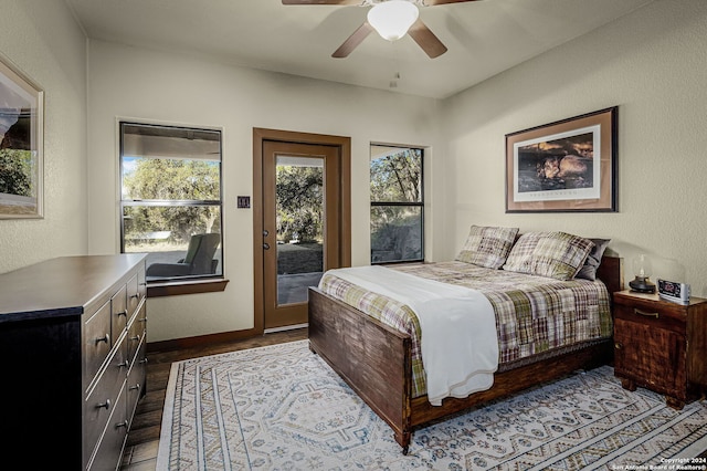 bedroom with access to outside, ceiling fan, and light hardwood / wood-style floors