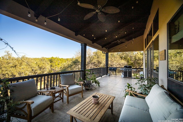 view of patio / terrace with area for grilling, ceiling fan, and an outdoor hangout area