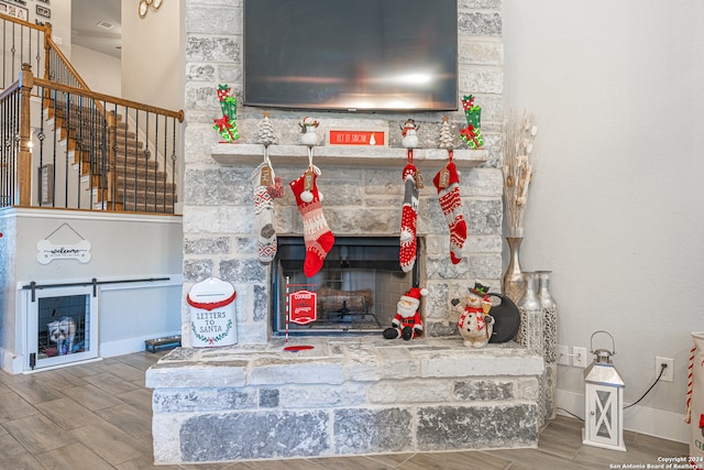 interior details with a fireplace and wood-type flooring