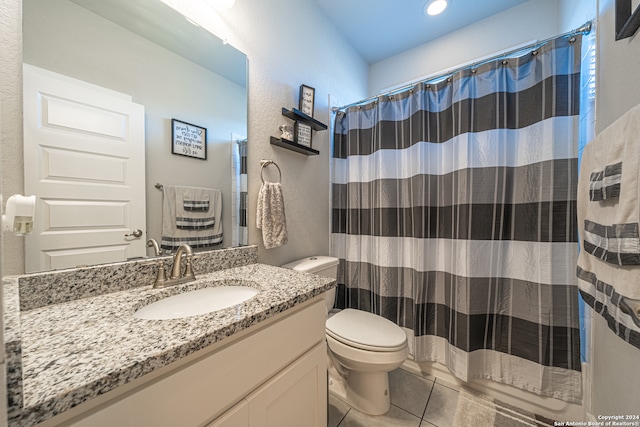 bathroom with tile patterned floors, vanity, toilet, and a shower with shower curtain