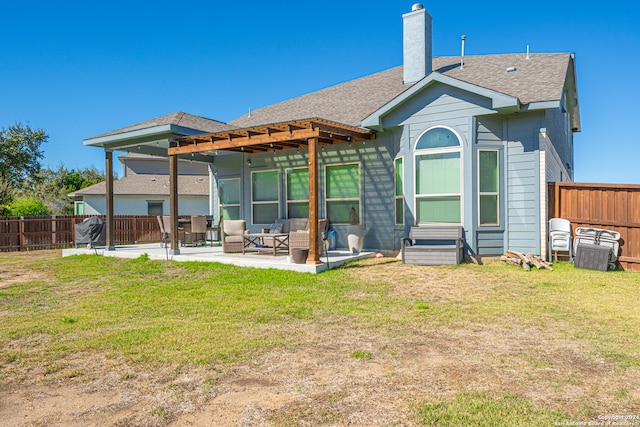 rear view of property with a patio and a lawn