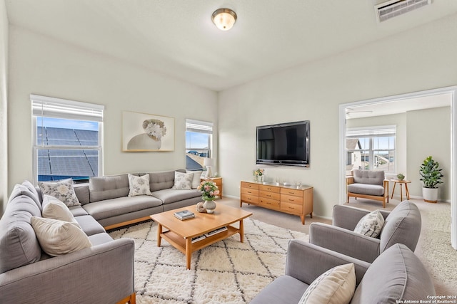 living room featuring light carpet