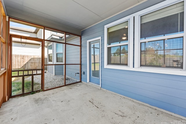 unfurnished sunroom featuring a healthy amount of sunlight